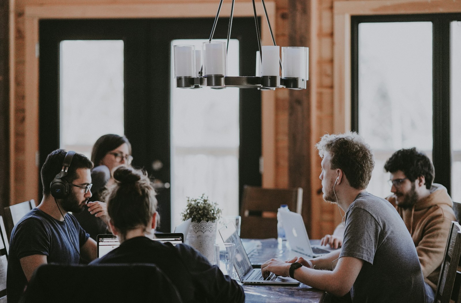 Team members collaborating at their desks